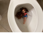 Barbie in the toilet