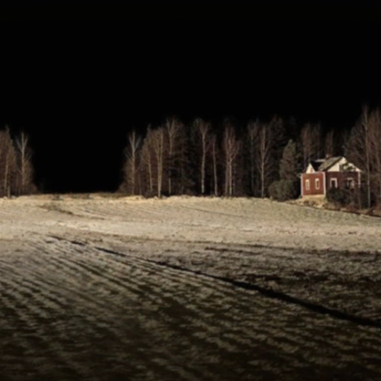 empty dark field with red home halloween
