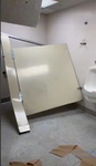 very dented metal bathroom stall door productions