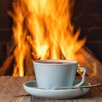 A cup of tea next to the fireplace is delightful