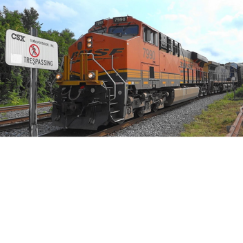 csx trains and bnsf and a train crossing. 