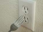 fork in electrical outlet studios
