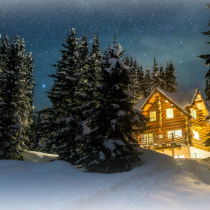Cozy cabin in the snowy night forest