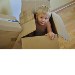 Kid in cardboard box