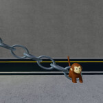 Monkey chained to street lamp.